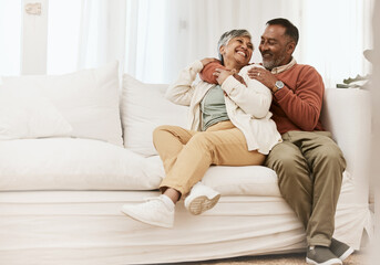 Poster - Happy, laugh and senior couple hug on sofa with conversation, care and romance in their home. Smile, embrace and elderly man with woman in living room relax, talking and enjoying retirement in house