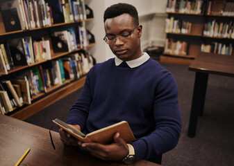 Aufkleber - University, book and black man student reading and learning in a college for knowledge development. Serious, education and person studying research to prepare for exam or assignment in a class