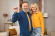 © Prostock-studio - Happy Senior Couple Showing Key Standing In New Home Indoor