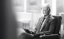 AI Robot Sitting Down Holding A Briefcase Waiting For A Job Interview