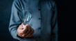 © sornthanashatr - lamp, light bulb, close up, hand, businessman, portrait, background, blue, hold, ideas. picture is close up to businessman, him hold light bulb. wait for best ideas and creates from other to light up.