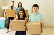 © AntonioDiaz - Beautiful children helping unpack boxes in their new home