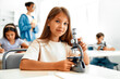© Valerii Apetroaiei - Children learning in a school classroom