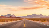 Fototapeta Natura - Route 66 highway road in the evening sunset with desert mountains in the background landscape