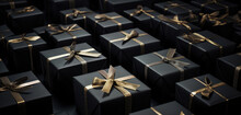 Arranged Present Gifts Boxes Wrapped In Black Paper With Gold Ribbon On Black Background