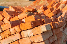 The Red Bricks Is Stacked On The Construction Site. The Red Bricks Is Used In The Construction Of Houses. Material For Construction