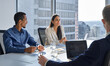 © insta_photos - Busy professional young diverse business team people working at in board table. International executive colleagues discussing financial project in office at group meeting in corporate boardroom.