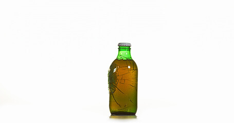 Wall Mural - Bottle of Beer Breaking and Splashing against White Background