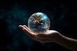© Elena - close up of a hand holding planet Earth. environment pollution, save clean planet and ecology, sustainable lifestyle