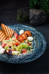 Canvas Print - Italian food Caesar salad with shrimp, parmesan cheese, eggs, lettuce, tomatoes, croutons, fried toast and basil.