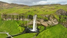 Aerial View Of Famous Waterfall Seljalandsfoss In Iceland. Epic Drone Shot Mountain Waterfall. Slow Motion Shot