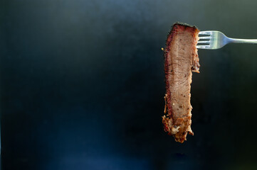 Canvas Print - smoked brisket pick up by a fork