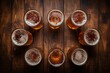 © SKIMP Art - a row of beer glasses lay in a circle on a wood table Generative AI