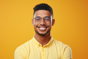 Picture of man wearing glasses and yellow shirt. This image can be used to represent stylish, modern look or for fashion-related content.