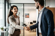 © Danny - Businesswoman shaking hands in office