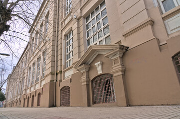 Wall Mural - Facade of a colonial historic building converted in college in a small south american town during winter afternoon (Talca, Chile) 