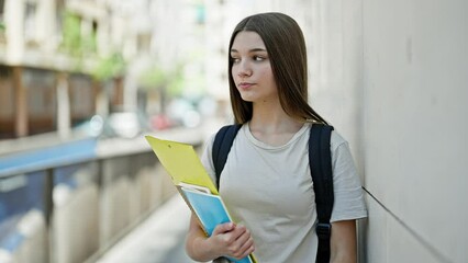 Canvas Print - Young beautiful girl student using smartphone with serious face at school