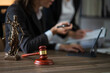 © aekachai - Judge gavel with Justice lawyers having team Concepts of Law and Legal services