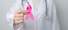 Pink October Breast Cancer Awareness Month, Doctor With Pink Ribbon In Hospital For Support People Life And Illness. National Cancer Survivors Month, Mother And World Cancer Day Concept