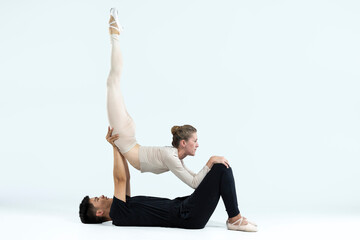 Asian Young Man and Caucasian Woman Performing As Ballet Dancers Over Grey in Studio During Suppots As Classical Dance Aesthetics With Choreography Art