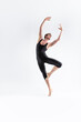 © danmorgan12 - Ballet Dancer Young Man in Black Dance Suit Posing in Ballanced Dance Pose Studio On White.
