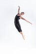 © danmorgan12 - Male Ballet Dancer Young Man in Black Dance Suit Posing in Flying Ballanced Dance Pose Studio.