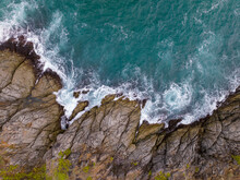 Waves Crashing On Seashore Rocks,Top View Sea Surface Waves Background