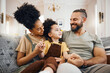 © Wesley/peopleimages.com - Smile, bonding and interracial family on the sofa for conversation, love and talking. Happy, house and a mother, father and a boy child on the couch for comfort, care and together for communication
