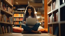 Girl Student Using Laptop Computer Sitting On Floor Among Bookshelves In University Campus Library Hybrid Learning Online, Doing College Course Study Or Research - Generative AI, Fiction Person
