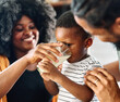 © Lumos sp - child family kitchen boy son mother father drink breakfast milk healthy drinking food eating glass home black african american father man together love cute childhood