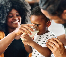 child family kitchen boy son mother father drink breakfast milk healthy drinking food eating glass home black african american father man together love cute childhood