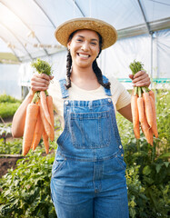 Wall Mural - Farming, portrait of woman with carrots and smile at sustainable small business, agriculture and natural food. Girl working at happy agro greenhouse, vegetable growth in garden and eco friendly pride