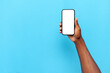 © Богдан Маліцький - african american male hand showing blank smartphone screen on blue isolated background, the hand advertises copy space