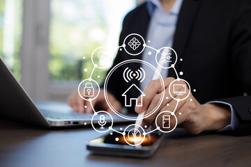 Hand using AI smart tablet with smart home app on the room, circular interface of the smart home automation assistant on the virtual screen and user touches the button, smart home digital interface