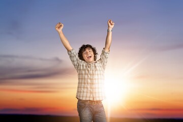 Wall Mural - Man feeling happy and free in nature background