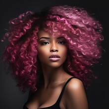 This Is A Stunning African-American Woman With Light Brown, Pink, And Curly Hair Against A Dark Backdrop.