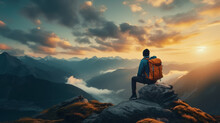 Man Hiker Sitting On Top Of A Mountain With A Backpack, Looking At The Sunset With Sky And Clouds Background Landscape