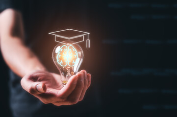 Man holding lightbulb showing graduation hat, Internet education course degree, knowledge creative thinking idea problem-solving solution, E-learning graduate certificate program concept