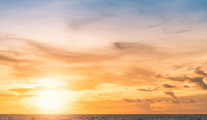 Wall Mural - sunset sky over horizon seascape in the evening with orange, yellow sunlight clouds, golden hour lan