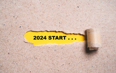 Wall Mural - 2024 start wording inside of yellow hole of tear paper for change new year from 2023 to 2024 , merry