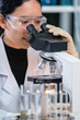 © chokniti - Closeup of Scientific microscope data analysis in the laboratory, medicine equipment setting in lab for chemistry or science research technology discovery, biotechnology or biology tool for study