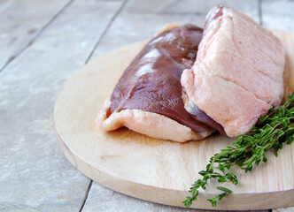 Wall Mural - raw duck fillet on a wooden board