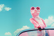 Smiling happy chameleon in a pink leather punk jacket posing in a retro convertible car on a sunny day. Generative AI.