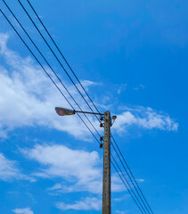 Electric pole with all two lights in one tree. with a lamp used to shine light In the afternoon with strong sunlight