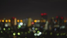 Blurred Of Night City Skyscraper And Tower Lights Bokeh , Soft Focus , Metropolis Backgound Wallpaper For Movie Or Documentary Romantic Mood Concept 