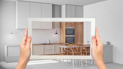 Wall Mural - augmented reality concept. hand holding tablet with ar application used to simulate furniture and de