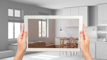 Wall Mural - augmented reality concept. hand holding tablet with ar application used to simulate furniture and de