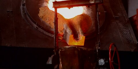 Wall Mural - Liquid iron molten metal pouring in container, industrial metallurgical factory, foundry cast, heavy industry 