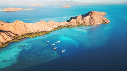 Wall Mural - Aerial view of the Komodo National Park. Live aboard boats anchored in the clam bay of the Komodo National Park in Indonesia