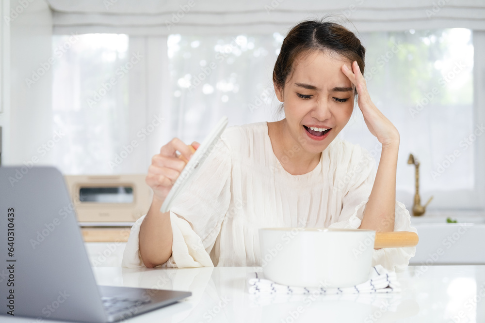 shocked scared upset young asian woman made mistake cook pot indoors ...
